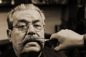 The final touch of a « handlebar » moustache